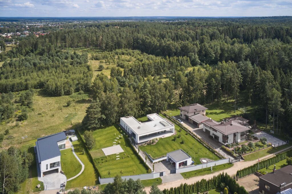 Aerial view of contemporary minimalist Villa AJ surrounded by forest near Vilnius, designed by NG Architects